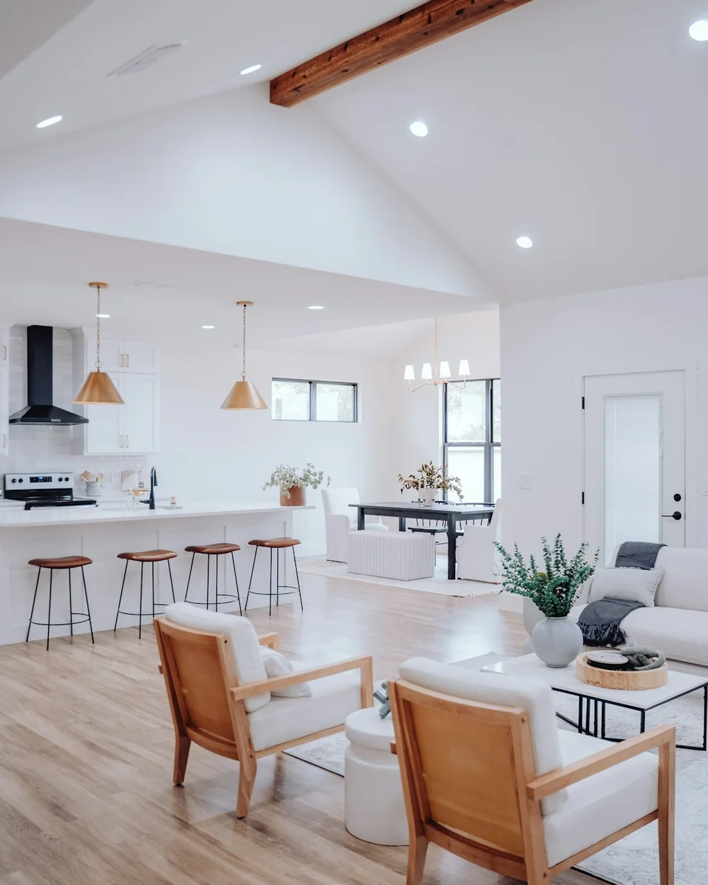 A bright, empty open-plan room after a move in/out clean